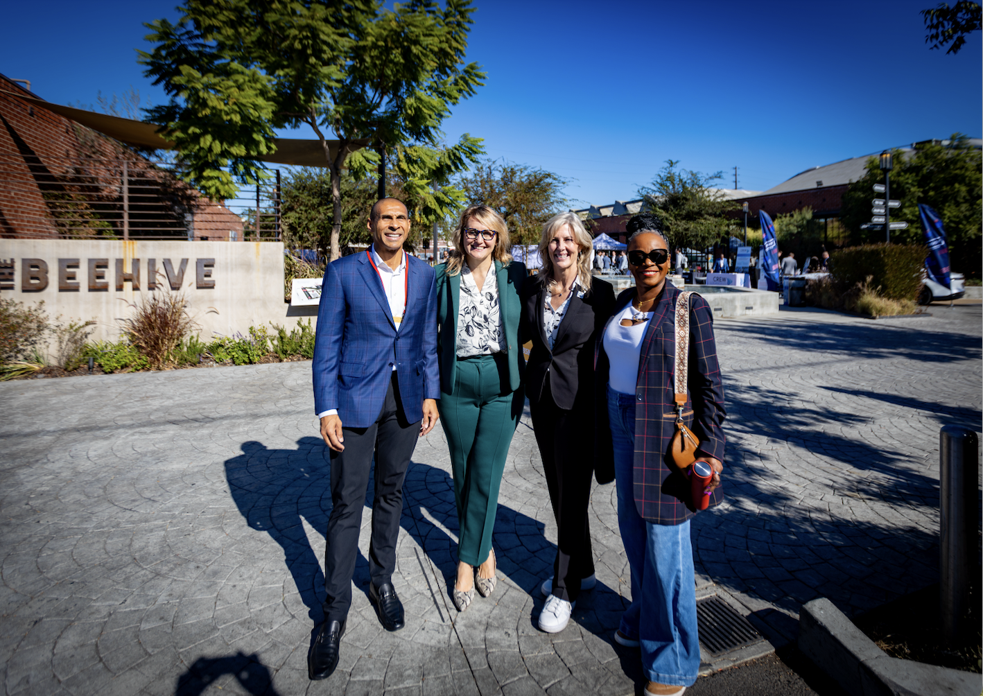 Assemblymember Wicks poses with tour attendees in Los Angeles 