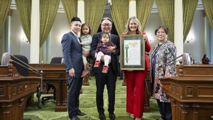 Asm. Wicks presents Dr. Morishita with framed resolution for his retirement on Assembly floor