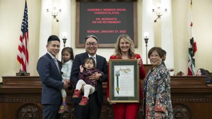 Asm. Wicks presents Dr. Morishita with framed resolution for his retirement on Assembly floor